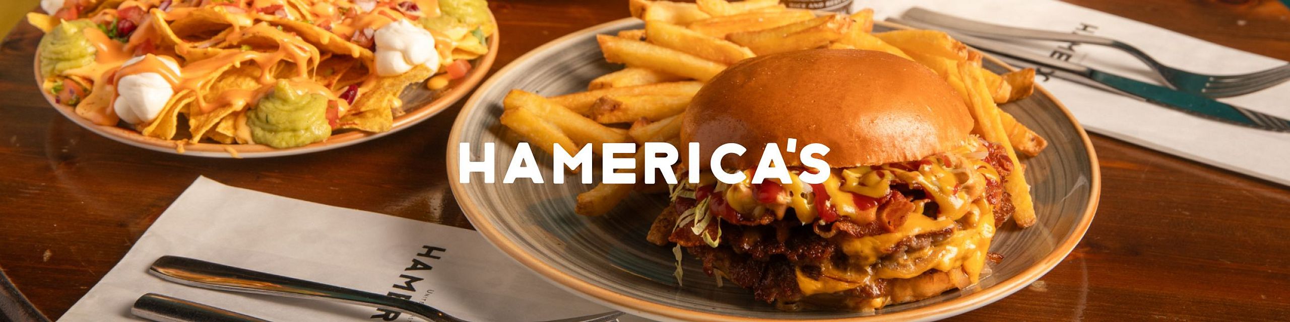 Hamerica's is a restaurant offering traditional American cuisine, specializing in various types of hamburgers and fries.
